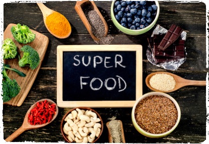 Super foods on rustic wooden background. Top view